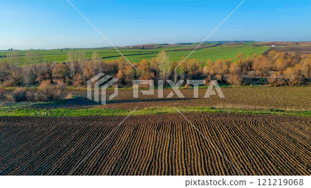 Plowed and sown fields under clear blue sky. Greece. Plowed and sown fields under clear blue sky. Greece. 121219068