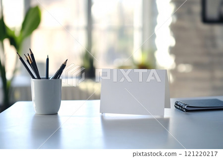 On a clean desk in a bright and modern office, a minimalistic anniversary card embodies simple 121220217