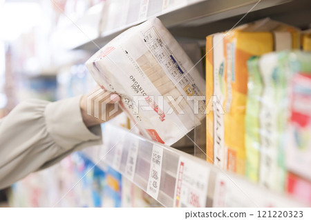 Woman buying sanitary products at the supermarket Woman buying sanitary products at the supermarket 121220323