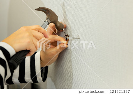 Installing hooks for displaying framed photographs Installing hooks for displaying framed photographs 121221357