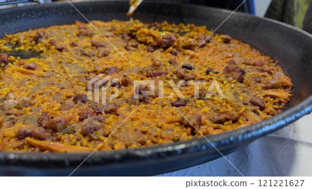 Delicious Iberian Secreto Paella Being Served Freshly Cooked Delicious Iberian Secreto Paella Being Served Freshly Cooked 121221627