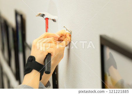 Installing hooks for displaying framed photographs Installing hooks for displaying framed photographs 121221885