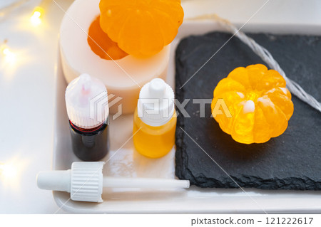 Handmade soap in the form of a tangerine with bottles of dye, flavor, a block of glycerin soap base, silicone mold, pipette. Soap as a gift, home-made 121222617