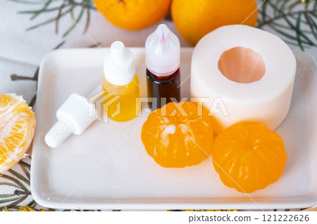 Handmade soap in the form of a tangerine with bottles of dye, flavor, a block of glycerin soap base, silicone mold, pipette. Soap as a gift, home-made 121222626