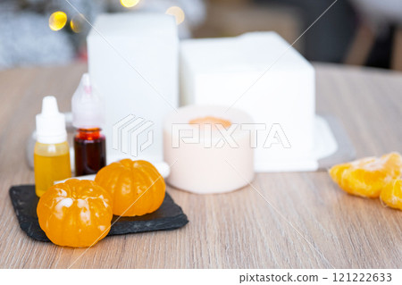 Handmade soap in the form of a tangerine with bottles of dye, flavor, a block of glycerin soap base, silicone mold, pipette. Soap as a gift, home-made 121222633