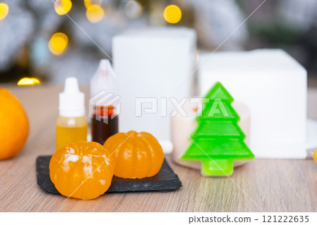 Handmade soap in the form of Orange tangerine And a green Christmas tree with bottles of dye, flavor, a block of glycerin soap base, silicone mold, pipette. Soap as a gift, home-made 121222635
