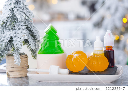 Handmade soap in the form of Orange tangerine And a green Christmas tree with bottles of dye, flavor, a block of glycerin soap base, silicone mold, pipette. Soap as a gift, home-made Handmade soap in the form of Orange tangerine And a green Christmas tree with bottles of dye, flavor, a block of glycerin soap base, silicone mold, pipette. Soap as a gift, home-made 121222647
