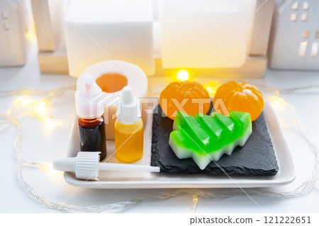 Handmade soap in the form of Orange tangerine And a green Christmas tree with bottles of dye, flavor, a block of glycerin soap base, silicone mold, pipette. Soap as a gift, home-made Handmade soap in the form of Orange tangerine And a green Christmas tree with bottles of dye, flavor, a block of glycerin soap base, silicone mold, pipette. Soap as a gift, home-made 121222651