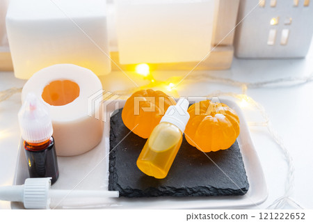 Handmade soap in the form of a tangerine with bottles of dye, flavor, a block of glycerin soap base, silicone mold, pipette. Soap as a gift, home-made Handmade soap in the form of a tangerine with bottles of dye, flavor, a block of glycerin soap base, silicone mold, pipette. Soap as a gift, home-made 121222652