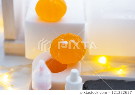 Handmade soap in the form of a tangerine with bottles of dye, flavor, a block of glycerin soap base, silicone mold, pipette. Soap as a gift, home-made 121222657