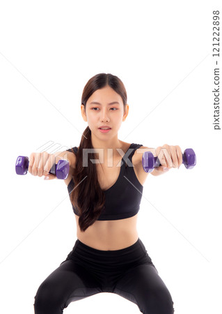 Young Woman Exercising with Dumbbells in Black Sportswear on White Background 121222898