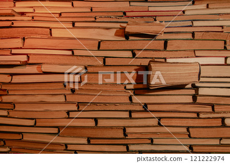 Antique bookshelf background in warm light. Pile of old books. Archive storage. Reading hobby. Library bookshelf. Literature concept. Bookstore in the night. Stacked retro books. Knowledge and wisdom. Antique bookshelf background in warm light. Pile of old books. Archive storage. Reading hobby. Library bookshelf. Literature concept. Bookstore in the night. Stacked retro books. Knowledge and wisdom. 121222974