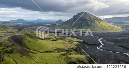 Stunning landscape with green hills and a prominent volcanic mountain in Iceland 121223256