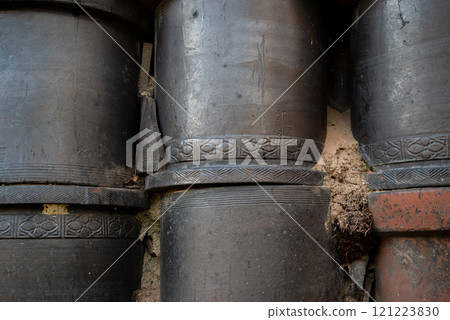 A beautiful wall with old pottery embedded in it 121223830