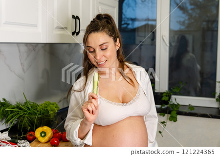 Pregnant Woman Preparing Healthy Meal in Kitchen Pregnant Woman Preparing Healthy Meal in Kitchen 121224365