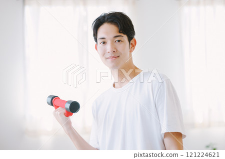 Man with dumbbells at home Man with dumbbells at home 121224621