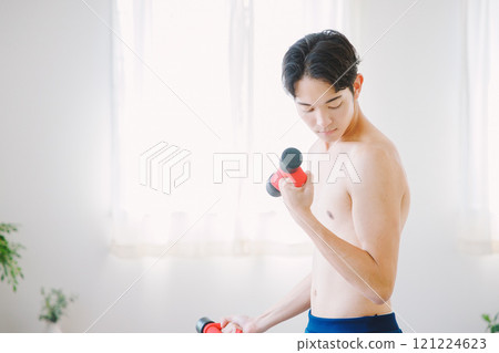 Man training with dumbbells Man training with dumbbells 121224623