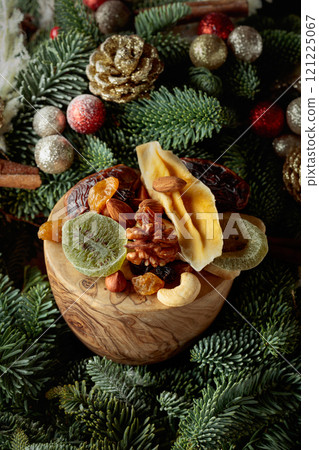Dried fruits and Christmas wreath. 121225067