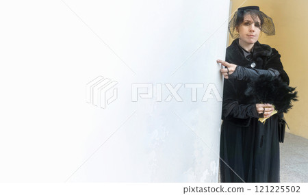Elegant fashionable adult woman wearing black dress  121225502