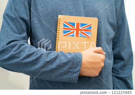 Learn English language, Asian teenage student hold book with flag in course at school. Learn English language, Asian teenage student hold book with flag in course at school. 121225885