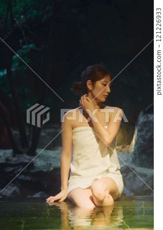 A young woman bathing in an open-air bath. Photo courtesy of Shiratama no Yu Izumi Kei 121226933