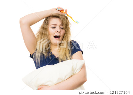 Sleepy woman hugging white pillow Sleepy woman hugging white pillow 121227164