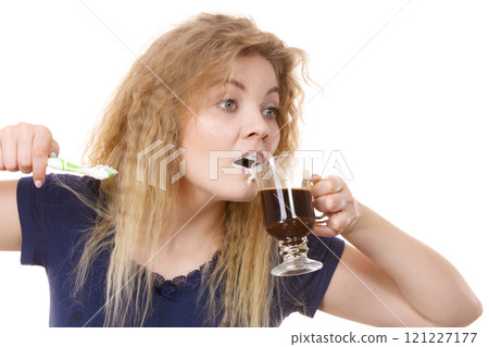 Funny woman being late drinking coffee 121227177