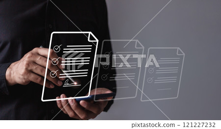 Young man with smartphone mobile hand using a pen touching to sign a Online Business Contract Young man with smartphone mobile hand using a pen touching to sign a Online Business Contract 121227232