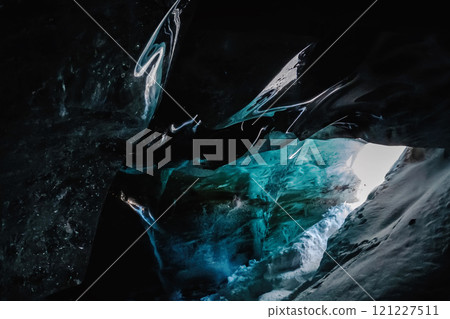 Ice cave: Entrance Near Bogdanovich Glacier, Tian Shan Mountains, Central Asia, Almaty, Kazakhstan's National Park, Zailiysky Alatau Natural Wonders. 121227511