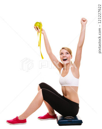 Woman raising her arms. Successful dieting slimming 121227622