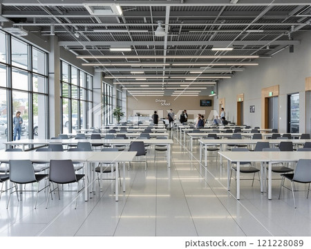 A Modern Office Cafeteria Featuring Spacious Seating Arrangements and a Welcoming Atmosphere 121228089