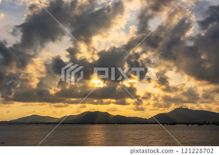 Beautiful clouds in sunset or sunrise over sea,Colorful scenery sunset sky, Amazing clouds wonderful light sky background 121228702