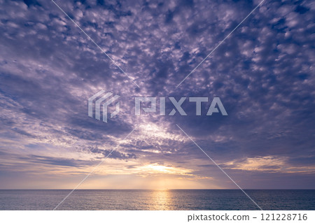 Beautiful clouds in sunset or sunrise over sea,Colorful scenery sunset sky, Amazing clouds wonderful light sky background 121228716