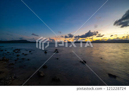 Beautiful clouds in sunset or sunrise over sea,Colorful scenery sunset sky, Amazing clouds wonderful light sky background 121228724