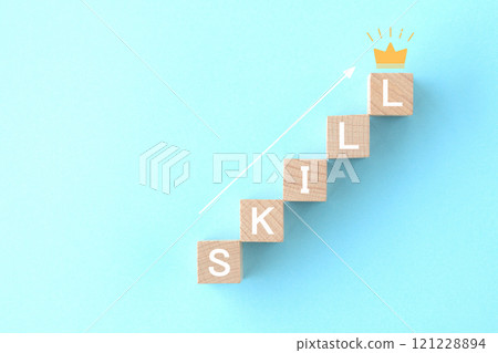 A block with the word "skill" written on it and a silhouette of a crown A block with the word "skill" written on it and a silhouette of a crown 121228894