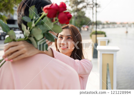 Romantic gesture of love riverside park couple portrait serene environment close-up view valentine delight 121228994