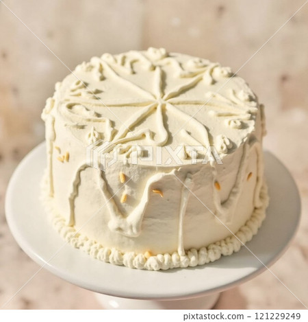 A simple yet elegant cake decorated with gold bells 121229249