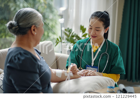 Senior Woman Getting Intravenous Therapy Senior Woman Getting Intravenous Therapy 121229445