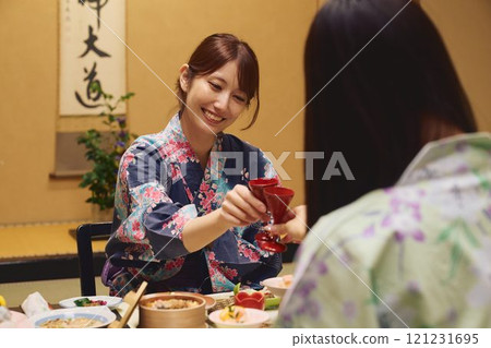 Women enjoying a meal at a ryokan (Japanese inn) Photo courtesy of Shiratama no Yu Izumikei 121231695