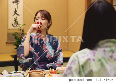 Women enjoying a meal at a ryokan (Japanese inn) Photo courtesy of Shiratama no Yu Izumikei 121231696