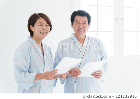 A couple undergoing a medical checkup (health check, medical care, patient) A couple undergoing a medical checkup (health check, medical care, patient) 121232916