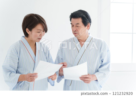 A couple undergoing a medical checkup (health check, medical care, patient) 121232920