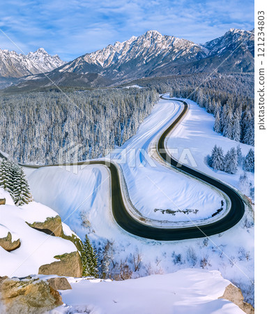 Road through a snow covered landscape - Canada 121234803