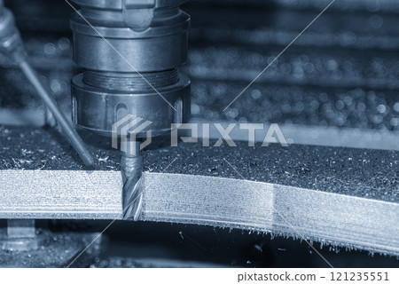 The CNC milling machine cutting mold parts with flat end mill tool in the light blue scene. The CNC milling machine cutting mold parts with flat end mill tool in the light blue scene. 121235551