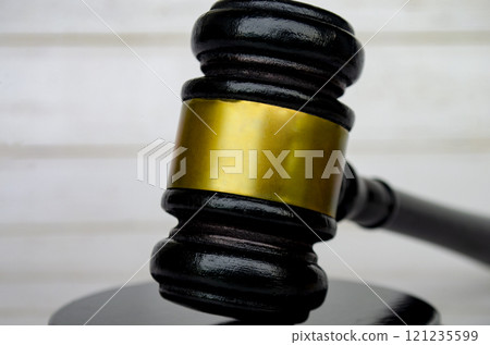 Close up of lawyer's gavel with customizable space for text. Laws and regulations concept Close up of lawyer's gavel with customizable space for text. Laws and regulations concept 121235599
