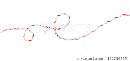 Curled white and red Christmas wrapping rope in a line arrangement isolated on white 121236515