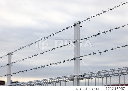 fence with Barb wire, metal chain with spike for safety and security purpose. fence with Barb wire, metal chain with spike for safety and security purpose. 121237967