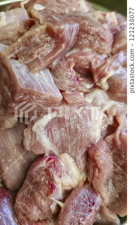 Turkey goulash for cooking homemade meat dish on a plate is cut into large cubes 121238077