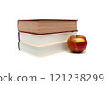 books and ripe apple on a white background 121238299
