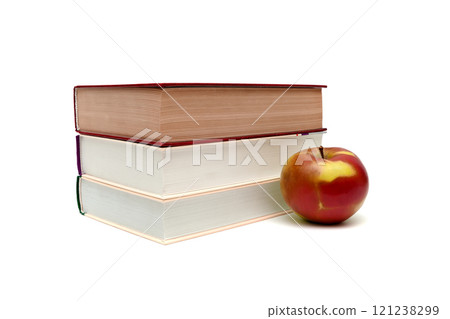 books and ripe apple on a white background 121238299